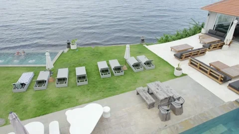 Luxury Villa with Infinity Pool Overlooking Waterfront, Elegant Outdoor Living Stock Footage 330860923