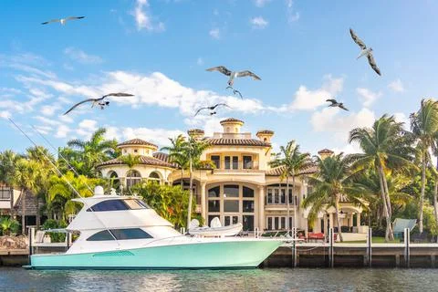 Luxury Waterfront Mansion in Fort Lauderdale Florida with flying seagulls Stock Photos