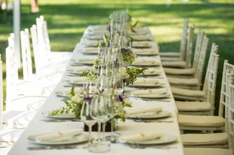 Luxury wedding lunch table setting outdoors.. Stock Photos