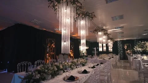 Luxury Wedding Reception Hall with Elegant Table Setup and Crystal Chandeliers Видео 334388691
