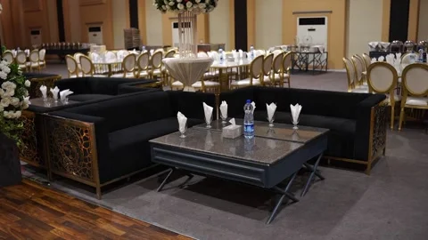 Luxury Wedding Reception Interior with Elegant White Tables, Golden Chairs and F Stock Footage 345229511