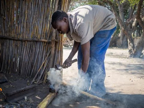 Luzibalule, Namibia - August 13, 2015: Unidentified African man operating Stock Photos