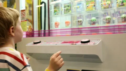 Lviv, Ukraine - June 7, 2021: Little boy playing on children slot machine in mod 스톡 동영상 158494053