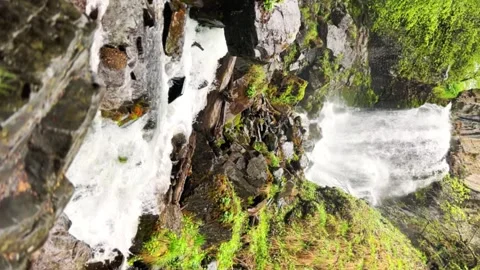 Lyazhginsky waterfall in the spring forest.  Stock Footage 254350066