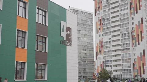 Lyceum located between high-rise residential buildings Stock Footage 306417274