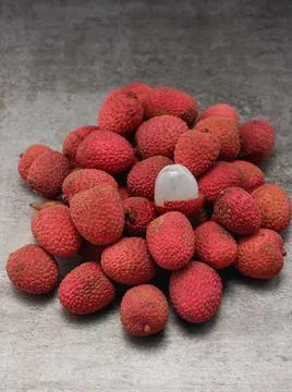 Lychee berries on the table, middle plan vertical format Stock Photos