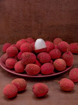 Lychee berries on the table, middle plan vertical format Stock Photos