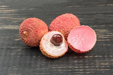Lychee fruit with half Stock Photos