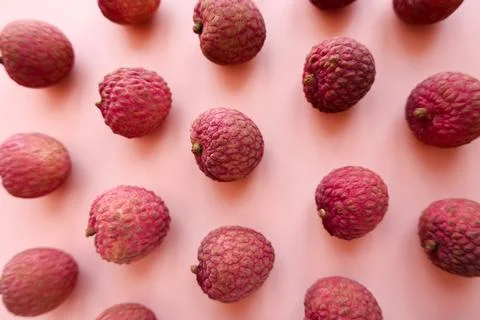 Lychee fruit pattern on pink background Stock Photos