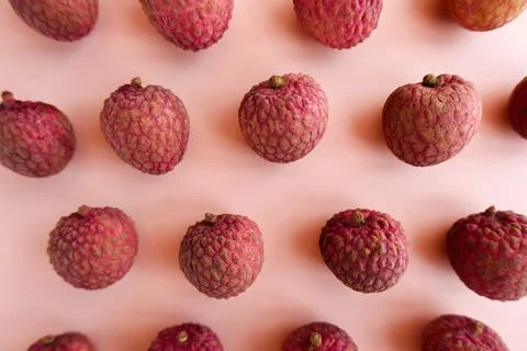 Lychee fruit pattern on pink background Stock Photos
