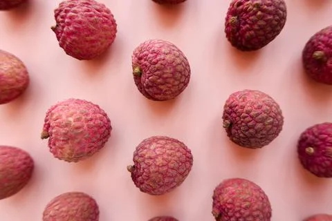 Lychee fruit on pink background Stock Photos