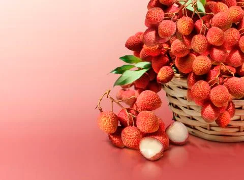 Lychee on red solid background Stock Photos