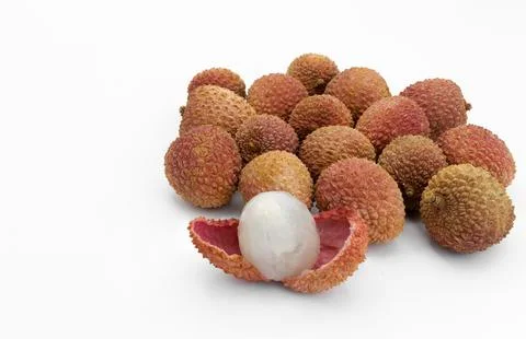 Lychees on white background, one open showing the pulp Stock Photos