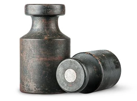 Lying and standing old rusty weights 스톡 사진