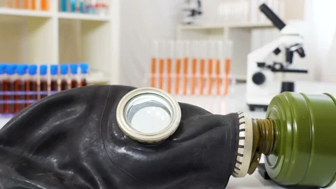 A lying black hazard face mask on the white table Stock Footage 129451468