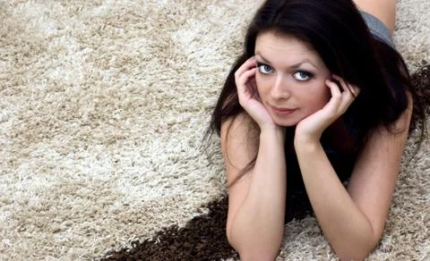 Lying on carpet Stock Photos