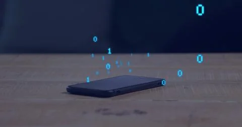 Lying dark smartphone emitting blue binary digits above wooden tabletop, showing Foto stock