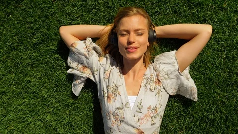 Lying down on the grass 스톡 동영상 107603179