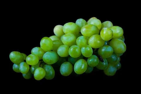 Lying grapes on black background Stock Photos