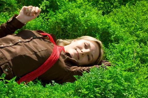Lying in green grass Stock Photos