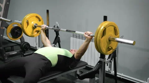 Lying man do exercise with barbell Stock-Footage 68411047