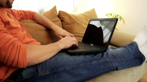 Lying man working on laptop Stock Footage 911746
