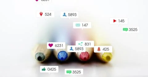 Lying row of four colored pencil tips reflecting on glossy tabletop, with Stock Photos
