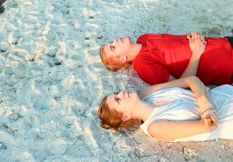 Lying on sand Stock Photos