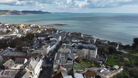 Lyme Regis Devon UK high street drone push in shot Stock Footage 333609147