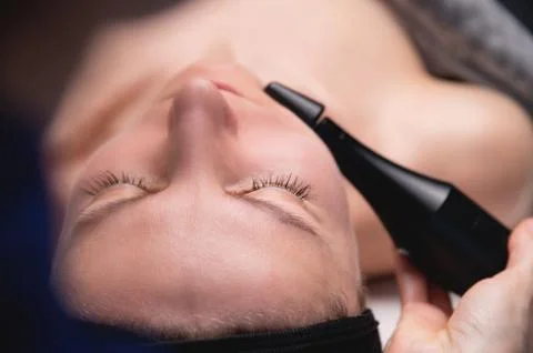 Lymphatic drainage massage is a hardware process. A cosmetologist-therapist Stock Photos