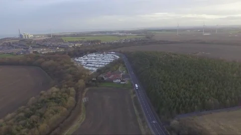 To Lynemouth over the field Stock Footage 85030839
