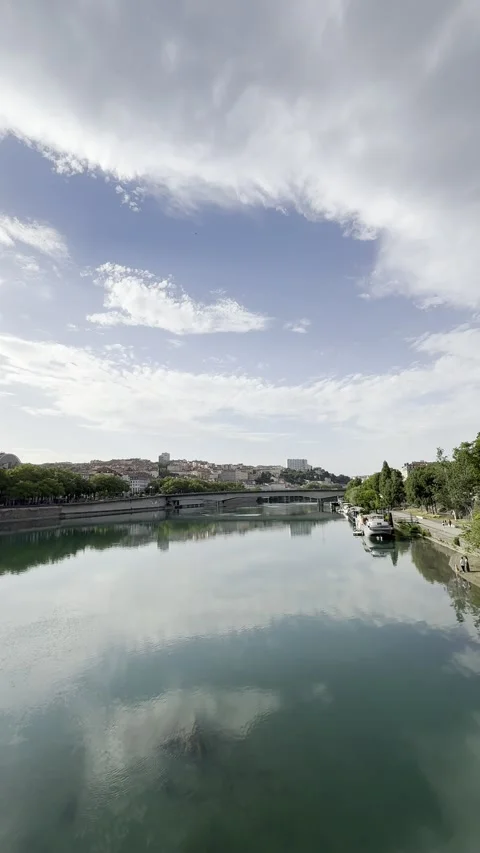 Lyon Rhône River and Croix-Rousse Skyline Under Dramatic Summer Clouds Stock Footage 339553845