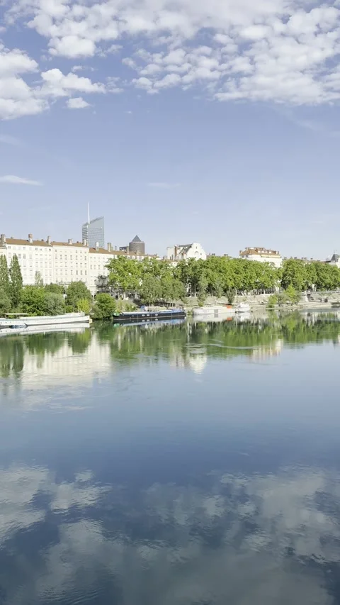 Lyon Riverside Skyline Reflected on the Rhône River Under Blue Summer Sky Stock Footage 339555492