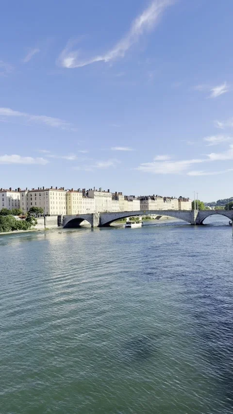 Lyon Skyline with Stone Bridge Over Rhône River Under Blue Summer Sky Stock Footage 340187831