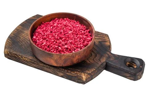 Lyophilized raspberry pieces with crunchy texture in bowl. Healthy superfoo.. Stock Photos
