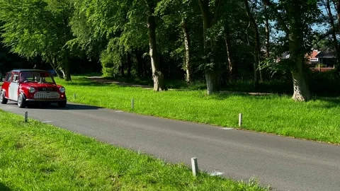 Lytham 19 May 2024; 1933 Armstrong Siddeley 14_Austin Seven, Rover Mini Cooper Stock Footage 276177959