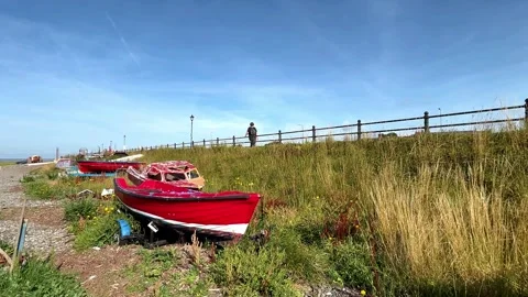 Lytham Saint Annes, UK 28 July,2024; Abandoned boats on pebble beach shoreline Stock Footage 280384547