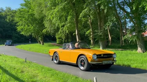 Lytham UK 19 May 2024: 1970s 70s seventies  TR6 Triumph Class cars Stock Footage 276153590
