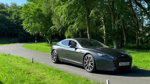 Lytham UK 19 May 2024: Aston Martin, Jensen, Peugeot, Classic Rover cars Stock Footage 276535529