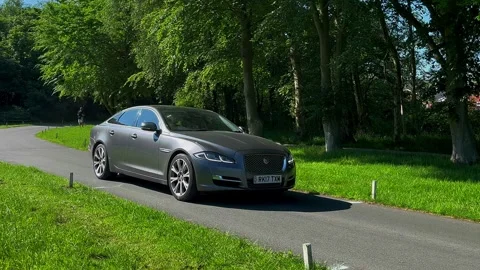 Lytham UK 19 May 2024: 2017 Grey Jaguar XJ V6 R-Sport 2993 cc performance cars Stock Footage 276543409