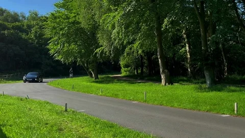 Lytham UK 19 May 2024; 1971 Morris MinoR Traveller, 2023 Porsche Cayman S S-A Stock Footage 276648211