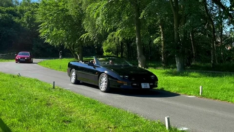 Lytham UK 19 May 2024;  1997 Black Chevrolet_ 2022 Toyota Corolla Icon HRV CVT Stock Footage 276652675