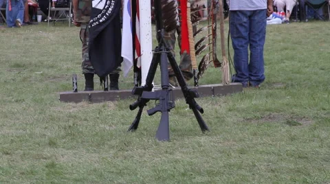 M-16 rifles stacked in middle of pow wow arena Video stock 47815039