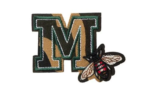 M letter with fly patch isolated on white background Stock Photos