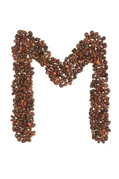 M letter made of cedar  nuts Stock Photos