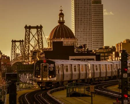 An M train on elevated tracks at the Marcy Avenue station in Brooklyn Stock Photos