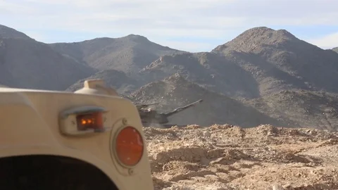 M1 Abrams tank tracking past parked Humvee at Twentynine Palms, California Stock-Footage 102768999
