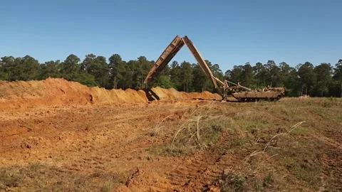 M1074 joint assault bridge system mobilizing over ditch Video stock 272427850
