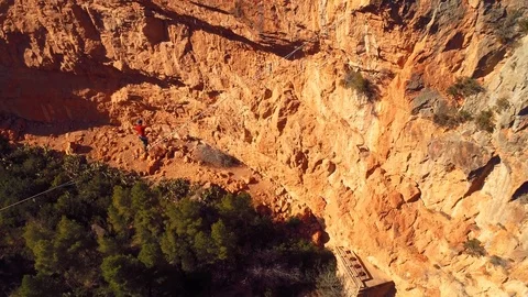 M2 Brave Man Slacklining , highlining above a big canyon . Nature Adventure Stock Footage 85259842