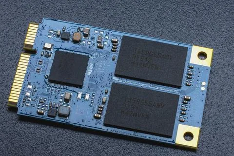M.2 format SSD module. Close-up of an electronic circuit board with gold-plat Stock Photos